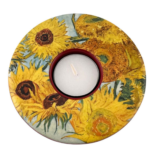 Round ceramic tea-light candle holder with a printed design of Van Gogh's Sunflowers painting.