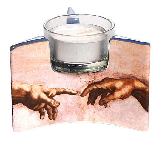 Ceramic tealight with a side panel featuring Michelangelo's famous painting of Adam and God's hand touching to create the spark of life.