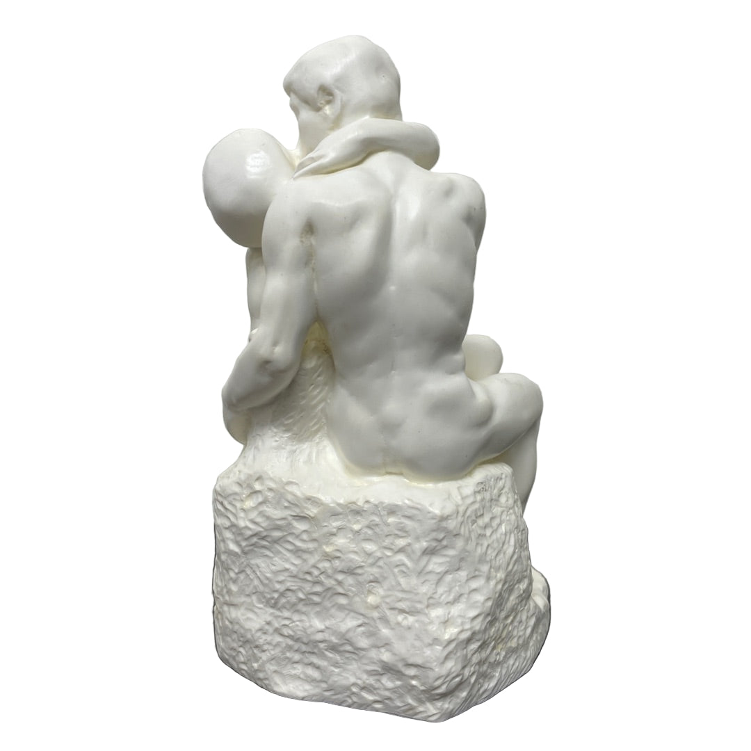 Desk-size Rodin The Kiss sculpture showing embracing couple.
