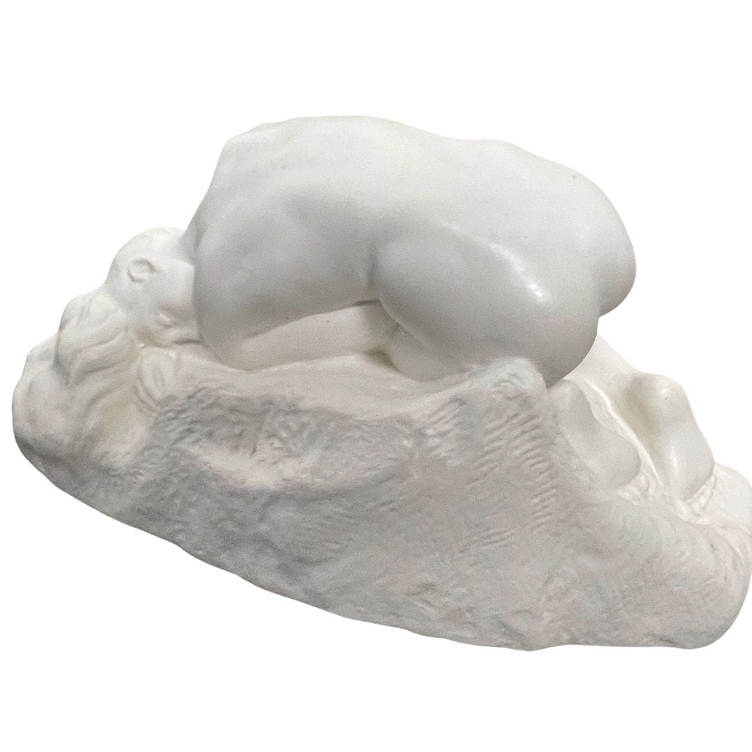 Side view of Rodin Danaide sculpture showing curved form and resting pose