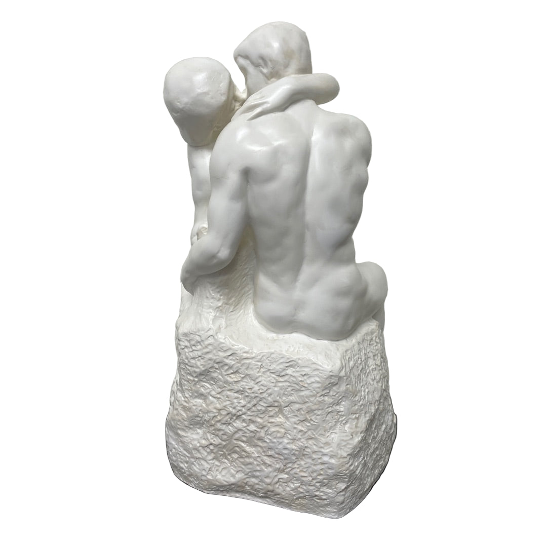 Desk-size white Rodin The Kiss statue with lovers in a tender embrace.